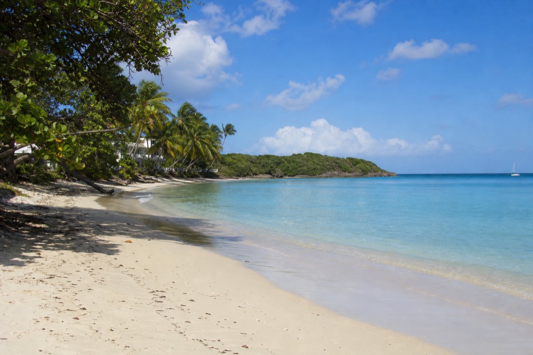Turquoise shallows over one of Antigua's white-sand beaches