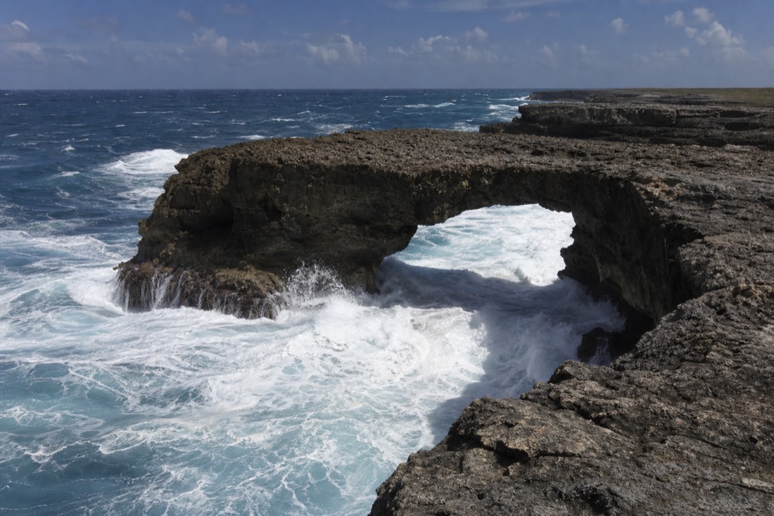 The natural limestone arch of Devil's Bridge on the Atlantic coast