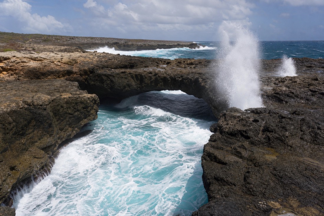 The natural limestone arch of Devil's Bridge on the Atlantic coast